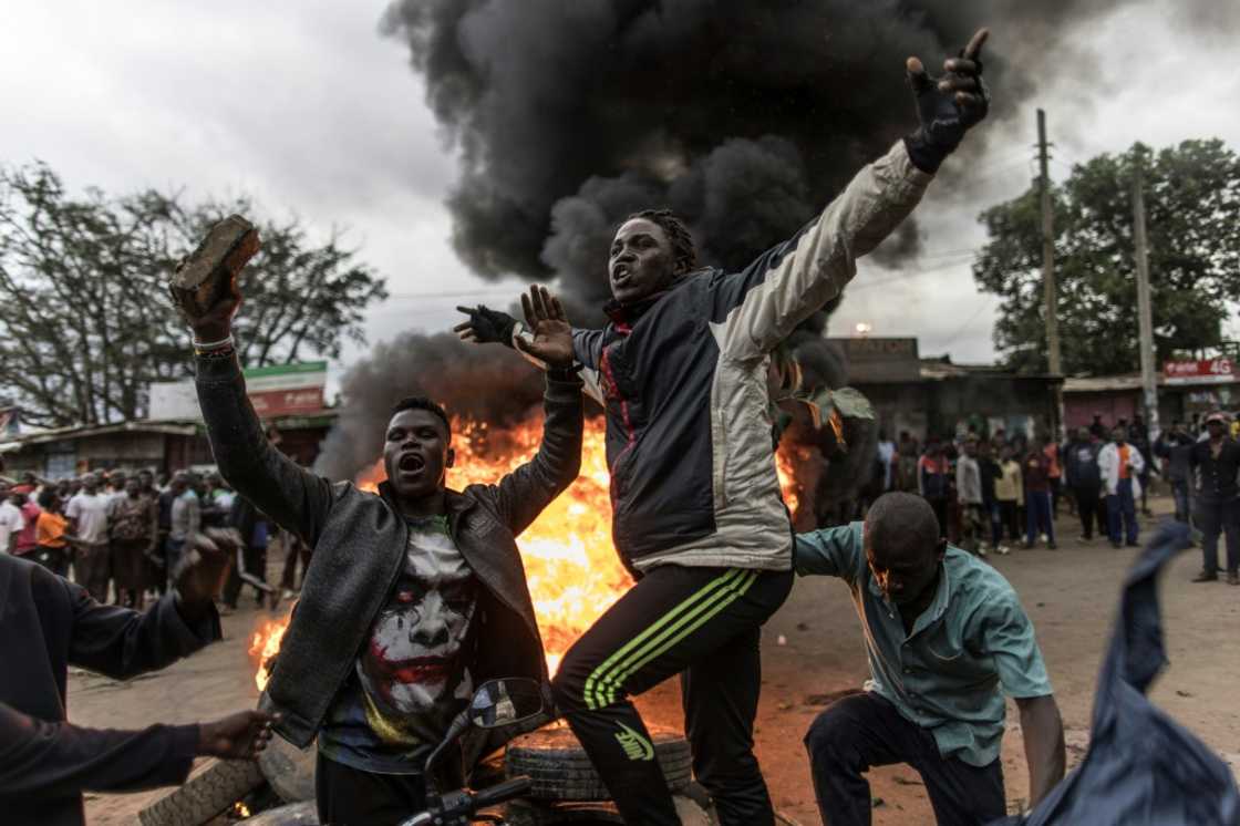 Supporters of Kenya's defeated presidential candidate Raila Odinga set tyres on fire in the Nairobi slum of Kibera Supporters of Kenya's defeated presidential candidate Raila Odinga set tyres on fire in the Nairobi slum of Kibera