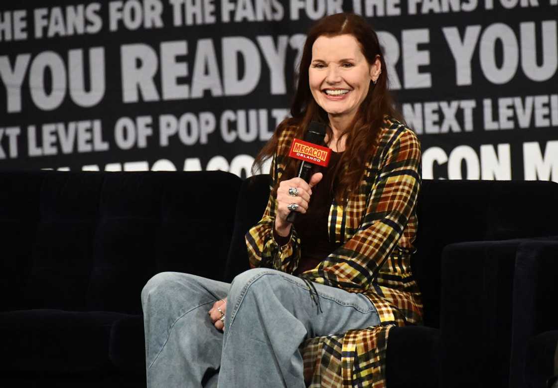 Geena Davis in a flannel cover up and denim jeans as she speaks during a Q&A session Geena Davis in a flannel cover up and denim jeans as she speaks during a Q&A session