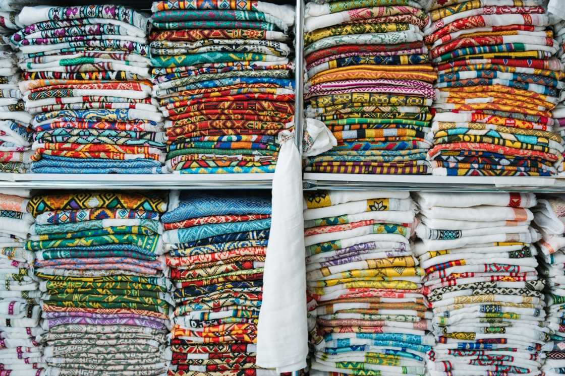 Handwoven fabrics, like these inside Belhu Balta's shop in Shiromeda, Addis Ababa, can make an occasion special, customers say