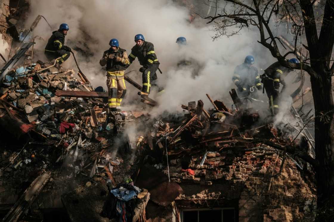 Ukrainian firefighters extinguish the smouldering rubble of a building hit in a drone attack in Kyiv Ukrainian firefighters extinguish the smouldering rubble of a building hit in a drone attack in Kyiv