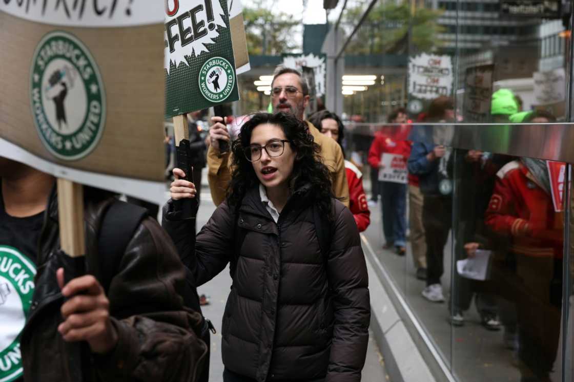 Starbucks workers protest outside one of the chain's coffee shops in New York in October 2025 Starbucks workers protest outside one of the chain's coffee shops in New York in October 2025