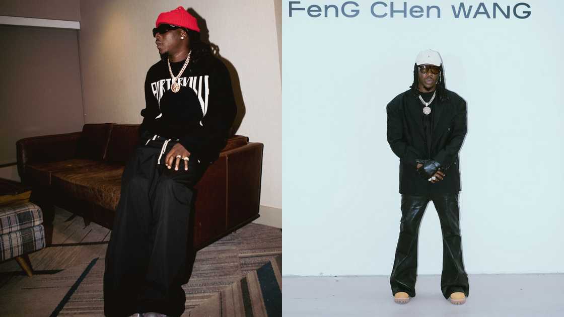 Stonebwoy in all-black clothes sitting on a brown couch and in front of a light blue wall Stonebwoy in all-black clothes sitting on a brown couch and in front of a light blue wall