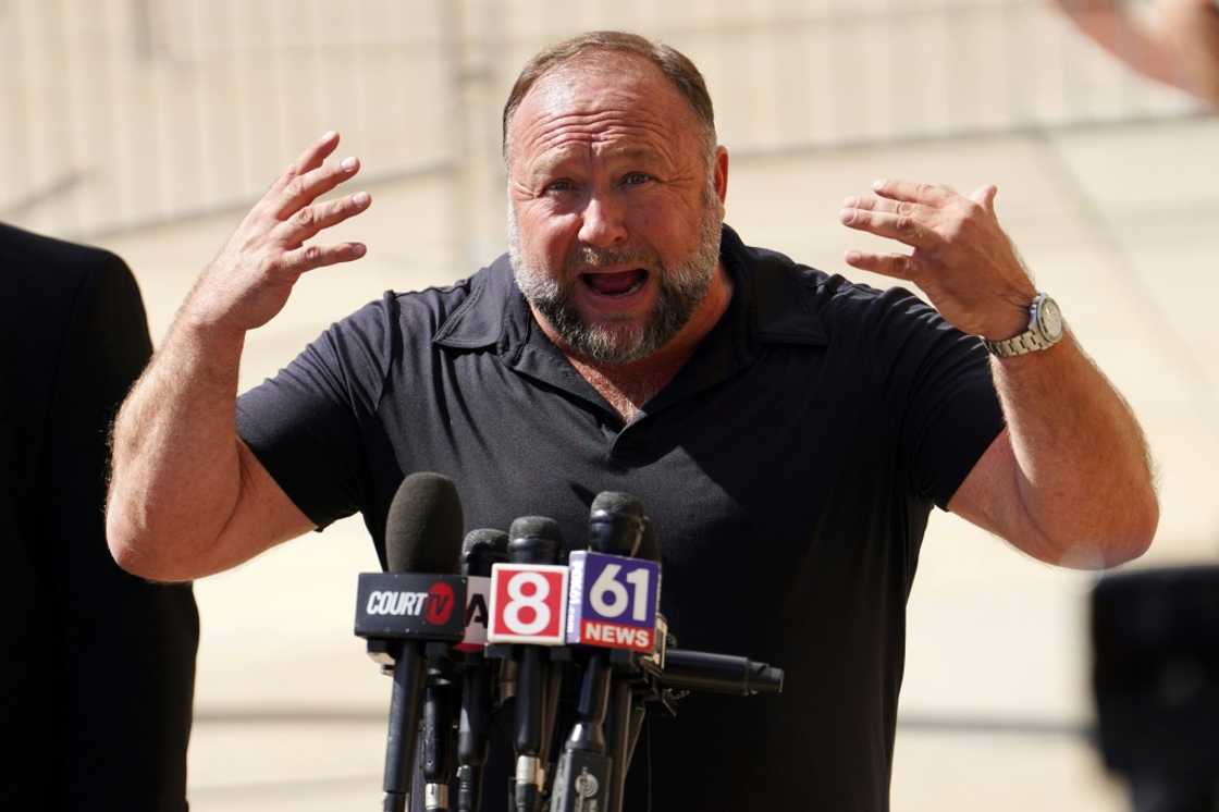 InfoWars founder Alex Jones speaks to the media outside Waterbury Superior Court during his trial, in Waterbury, Connecticut in September 2022