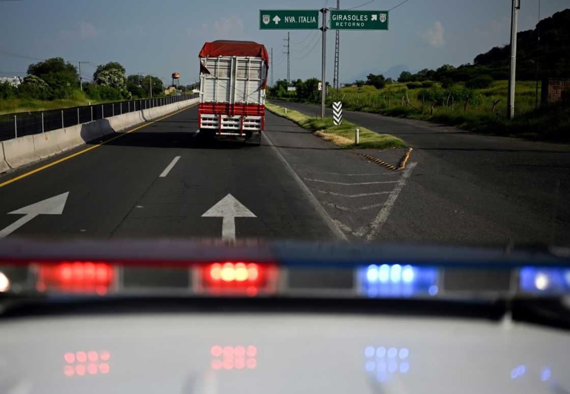 Police escort a truck carrying limes in Mexico's Michoacan state Police escort a truck carrying limes in Mexico's Michoacan state