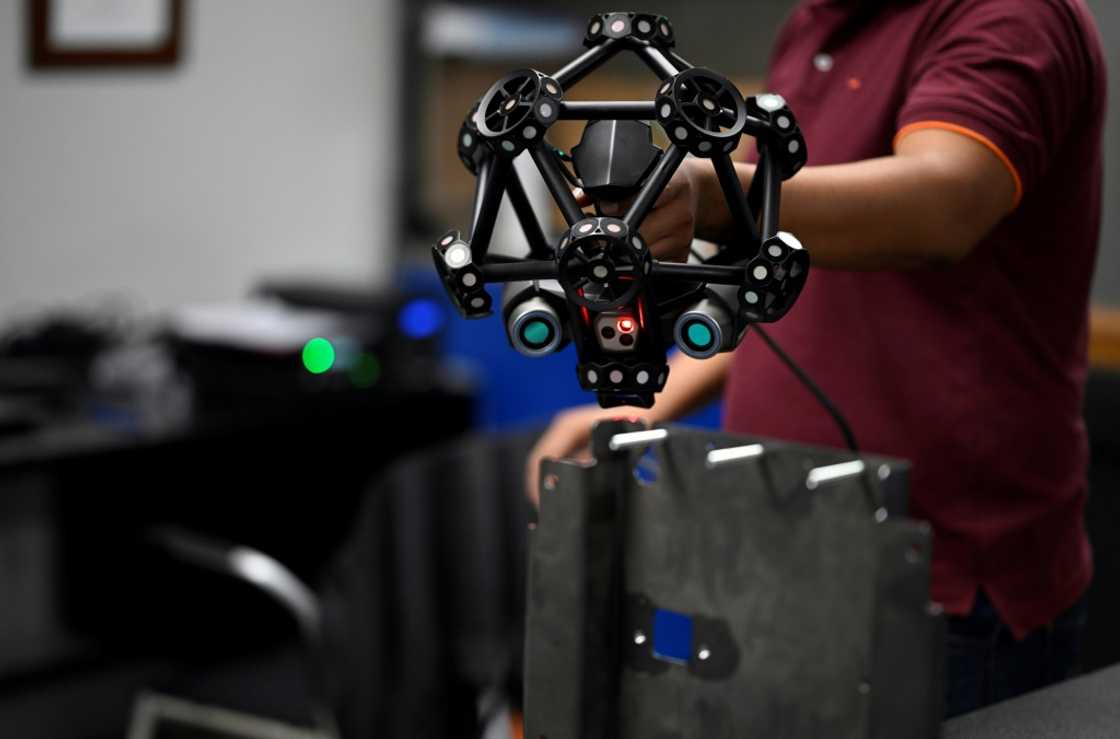 A worker carries out a 3D scan at an Aztek Technologies plant in northern Mexico