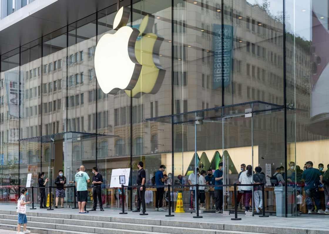 People enter an Apple store in Shanghai in June 2022 amid rising US calls to reduce reliance on China's giant economy People enter an Apple store in Shanghai in June 2022 amid rising US calls to reduce reliance on China's giant economy