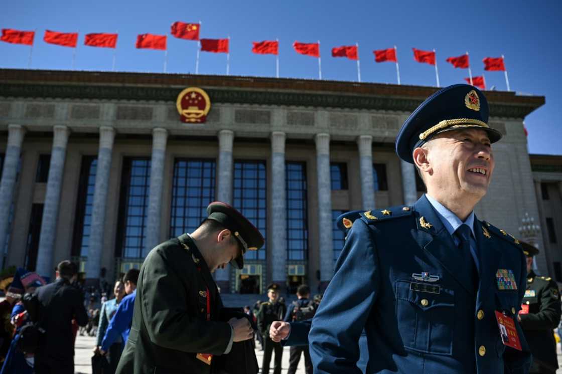 Delegates react after the closing ceremony of the 20th Communist Party Congress at the Great Hall of the People in Beijing Delegates react after the closing ceremony of the 20th Communist Party Congress at the Great Hall of the People in Beijing