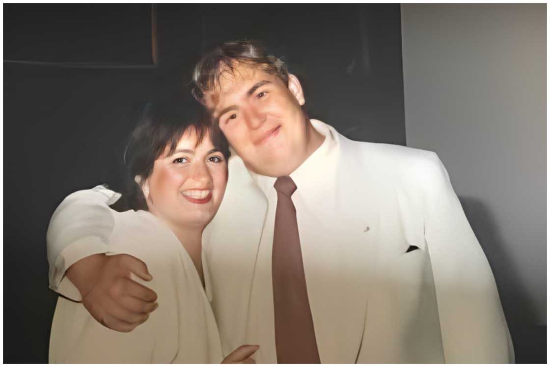 John and Rosemary, hugging each other.