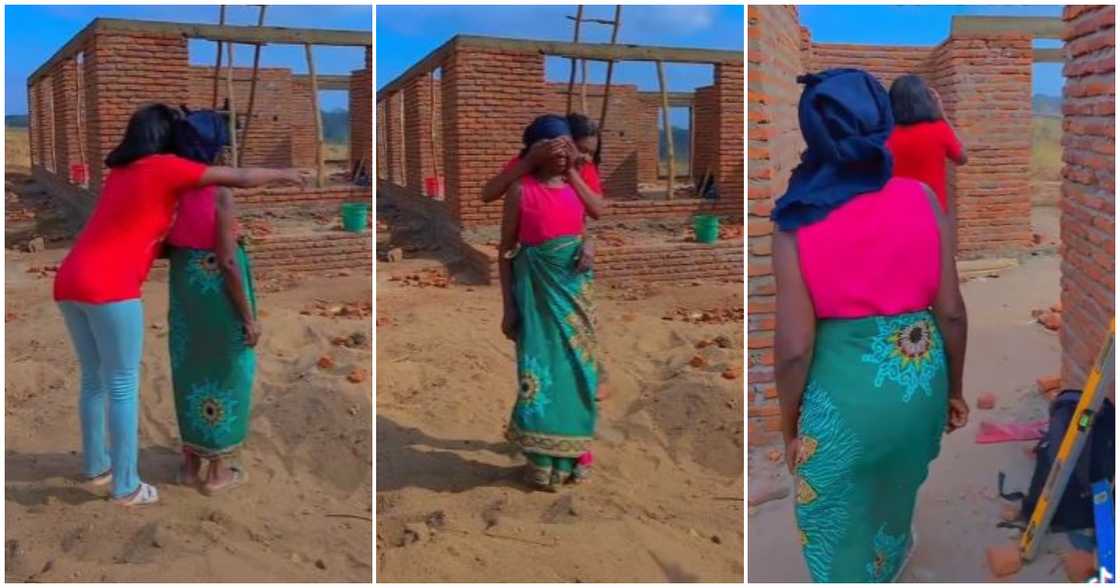 A lady shows her grandma the house she is building for the family