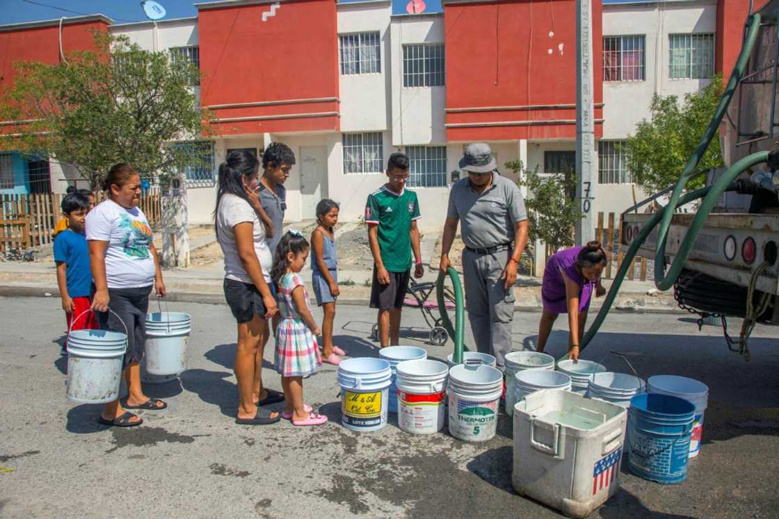 Residents of the northern Mexican city Monterrey queue for drinking water delivered by a tanker truck Residents of the northern Mexican city Monterrey queue for drinking water delivered by a tanker truck