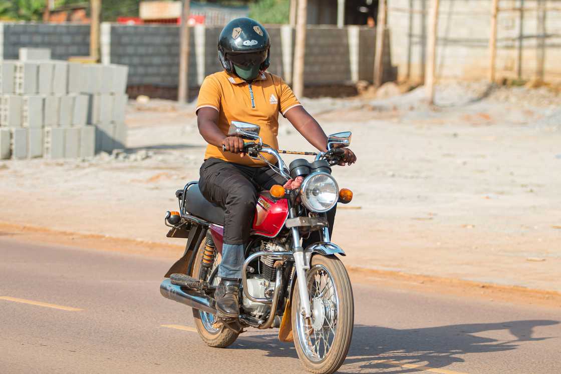 A man on a motorbike A man on a motorbike