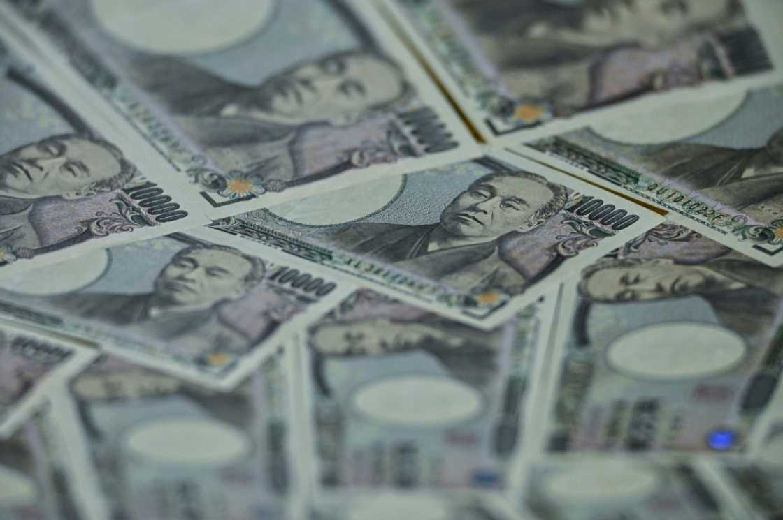 The yen hit a nine-month high against the dollar after a Bank of Japan official said it would keep tightening monetary policy if the economy performs as expected