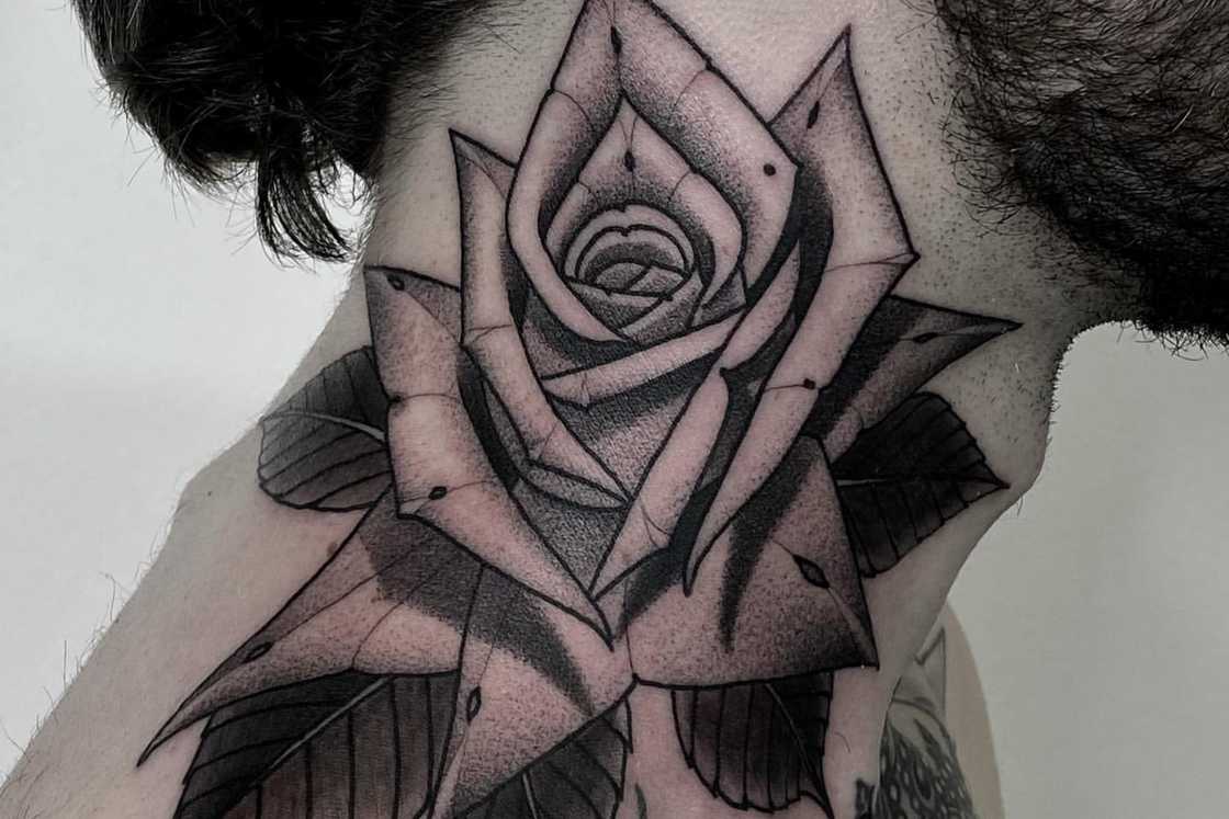 A large neck black and gray rose tattoo with whip shading A large neck black and gray rose tattoo with whip shading
