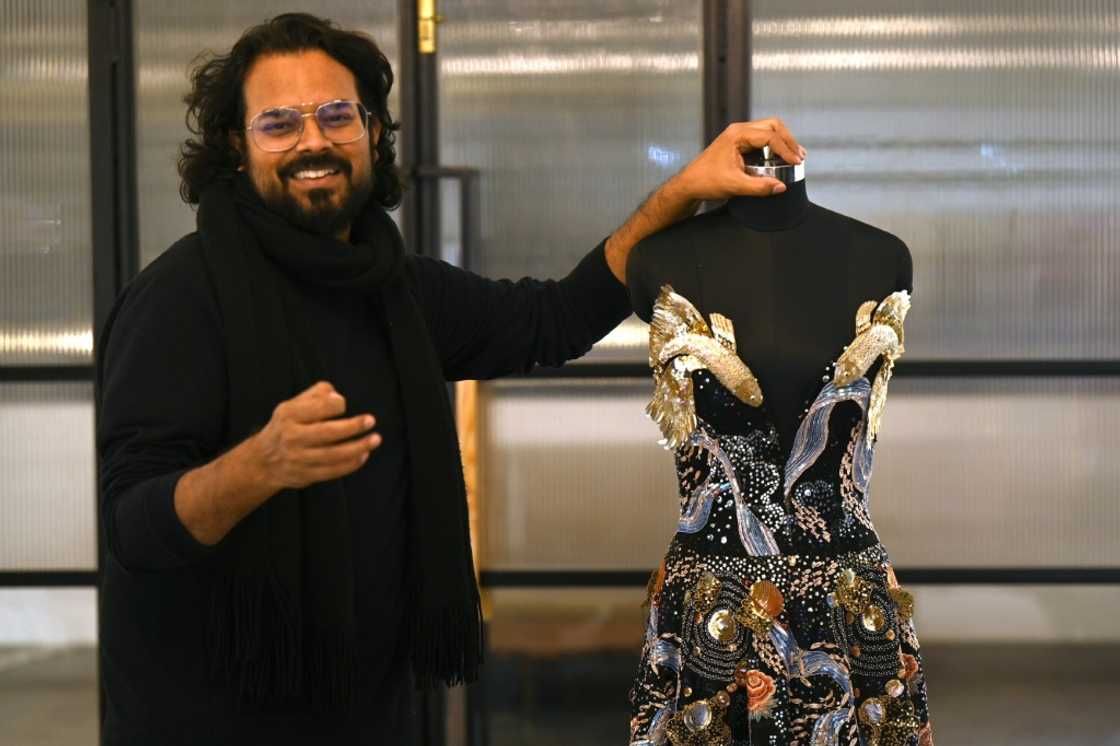 Indian fashion designer Rahul Mishra's new collection, "Cosmos", evokes the boundless mysteries of life, told through his trademark embroidered flourishes of animal contours and luminous details Indian fashion designer Rahul Mishra's new collection, "Cosmos", evokes the boundless mysteries of life, told through his trademark embroidered flourishes of animal contours and luminous details