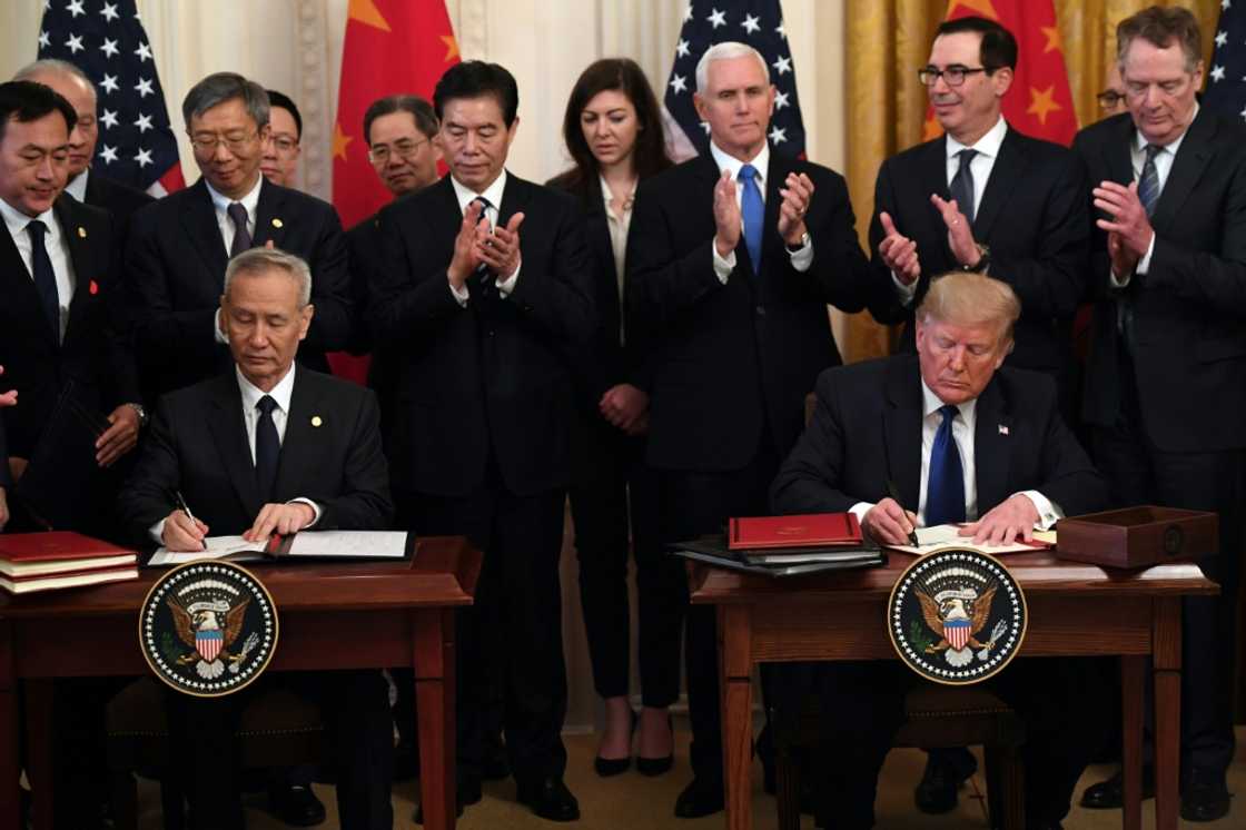 Then US president Donald Trump and China's Vice Premier Liu He sign a trade agreement between the US and China during a ceremony in the White House in January 2020 Then US president Donald Trump and China's Vice Premier Liu He sign a trade agreement between the US and China during a ceremony in the White House in January 2020