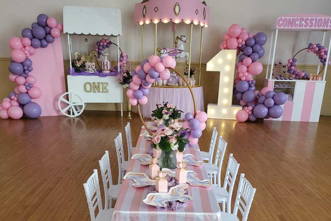 Princess carousel first birthday theme with a colourful dessert table