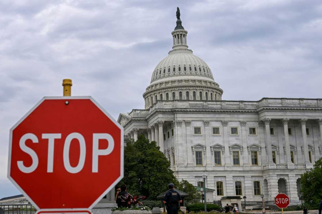 A stop sign is seen in front of the US Capitol -- where talks to repoen the federal government have seen little progress A stop sign is seen in front of the US Capitol -- where talks to repoen the federal government have seen little progress