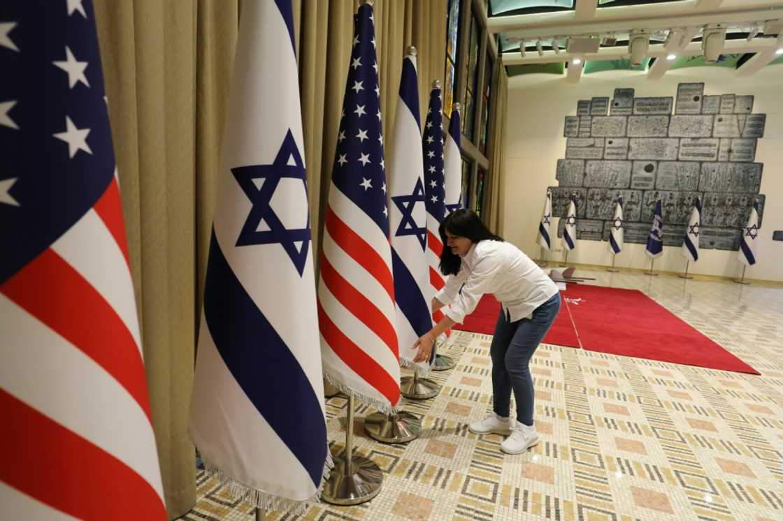 National flags being readied for display at the residence of Israel's president, ahead of Joe Biden's first visit as US head of state National flags being readied for display at the residence of Israel's president, ahead of Joe Biden's first visit as US head of state