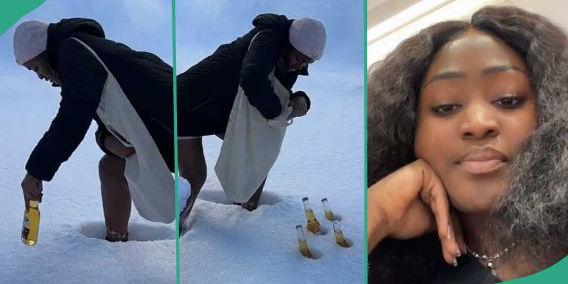 Lady puts her drinks in snow.