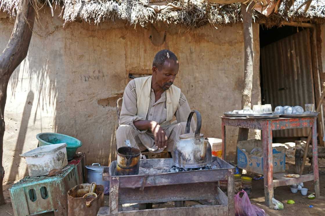 Abdalla Ibrahim, who owns a coffee shop, has several of his seven children either working with him or at a bakery Abdalla Ibrahim, who owns a coffee shop, has several of his seven children either working with him or at a bakery