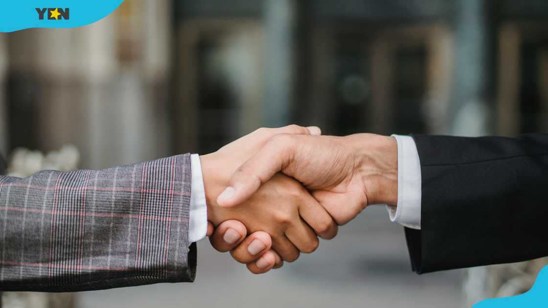 Two people are shaking hands