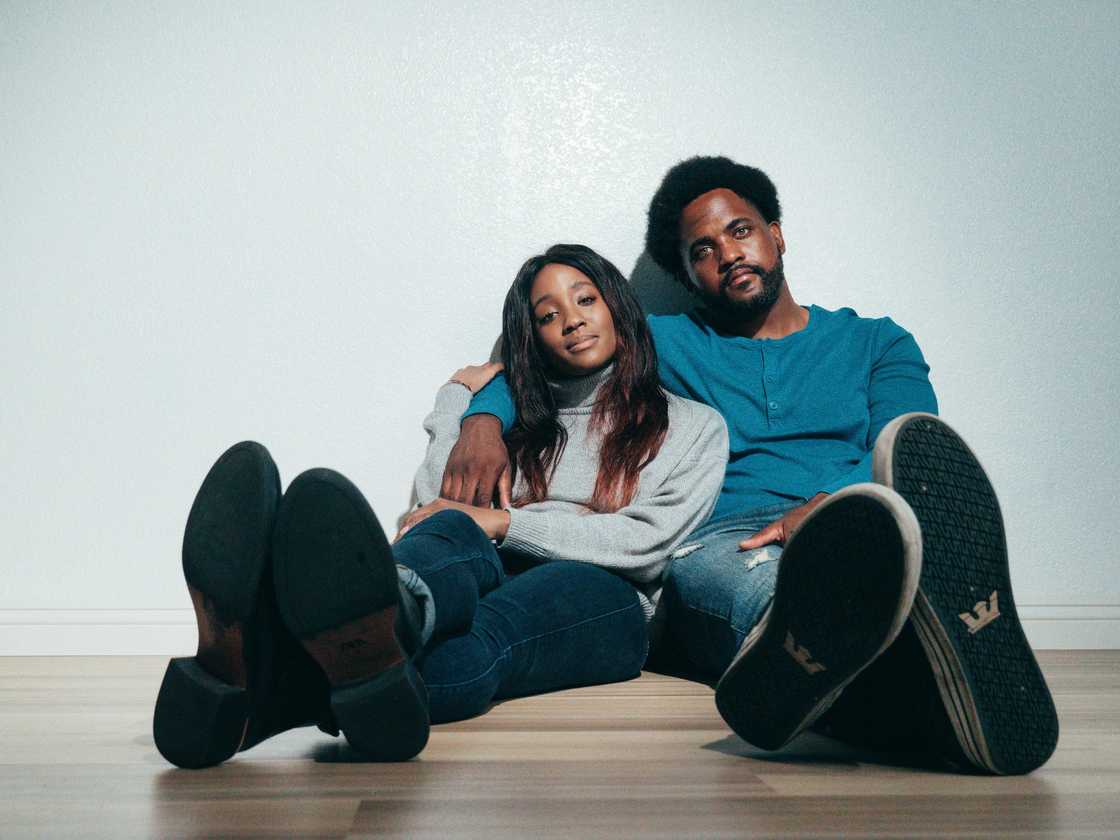 A couple sitting at home