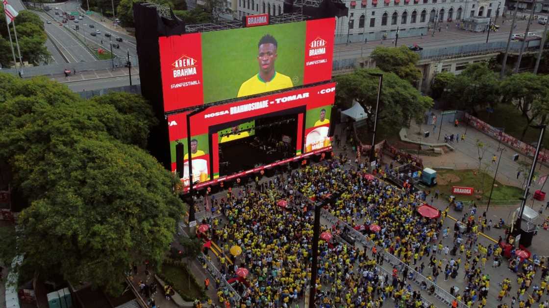 Fans of Brazil watch the broadcast of the Qatar 2022 World Cup Group G football match between Brazil and Serbia at the FIFA Fan Festival, in Vale do Anhangabau, Sao Paulo, Brazil, on November 24, 2022