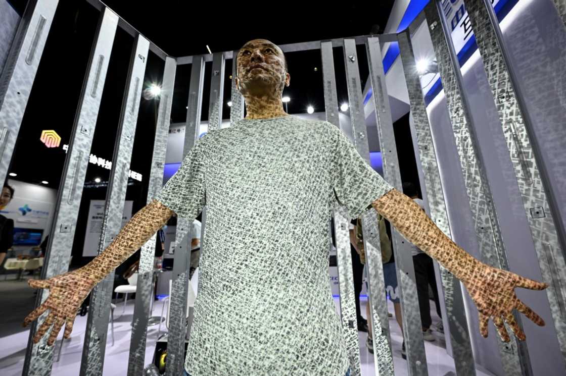 A man is scanned to create his avatar during the World Metaverse Conference in Beijing on August 26, 2022 A man is scanned to create his avatar during the World Metaverse Conference in Beijing on August 26, 2022