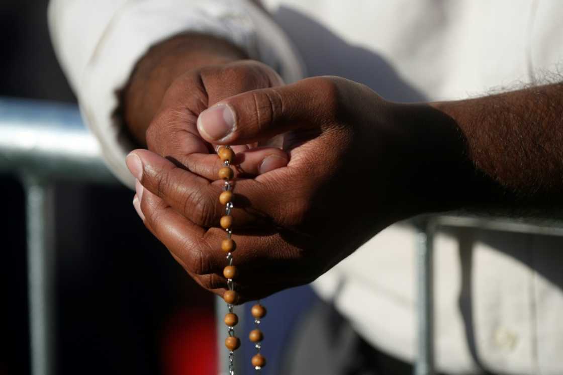 Catholic faithful await Pope Francis at the shrine of Sainte-Anne-de-Beaupre in Quebec, Canada, on July 28, 2022 Catholic faithful await Pope Francis at the shrine of Sainte-Anne-de-Beaupre in Quebec, Canada, on July 28, 2022