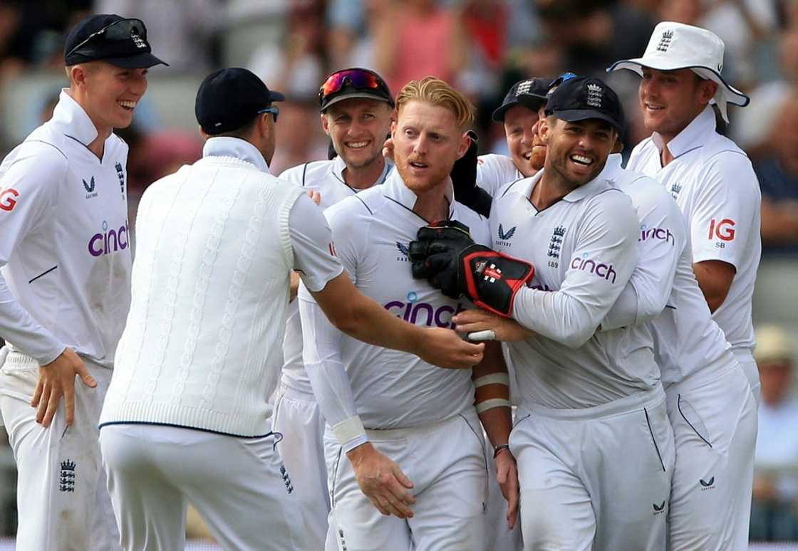 England captain Ben Stokes (C) celebrates after dismissing South Africa's Rassie van der Dussen in the second Test at Old Trafford