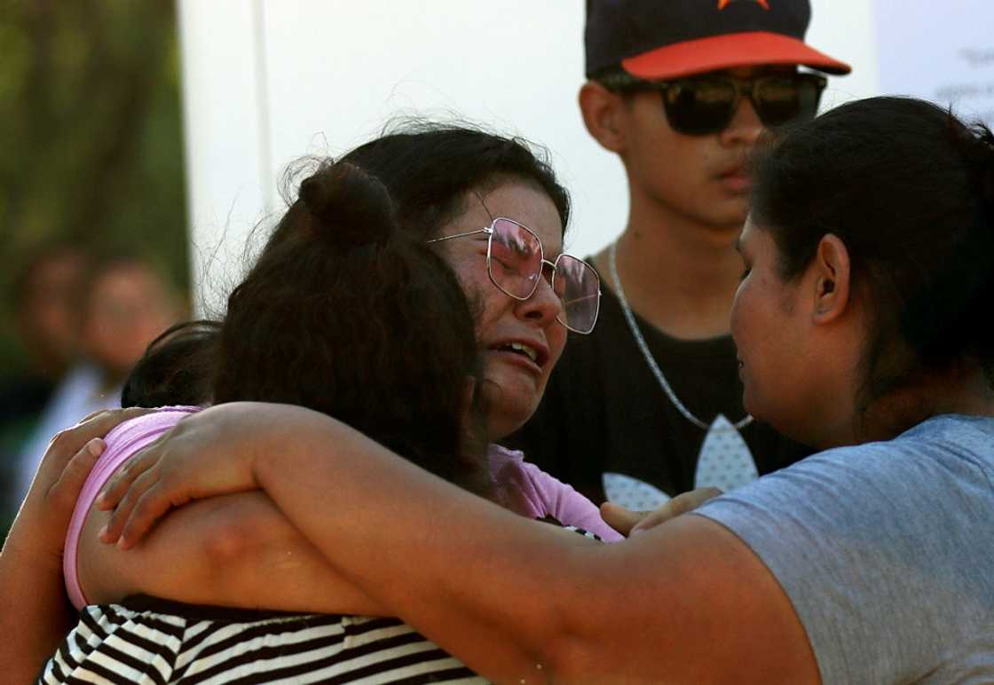 Relatives comfort each other after 10 miners were trapped in a cave-in in northern Mexico Relatives comfort each other after 10 miners were trapped in a cave-in in northern Mexico