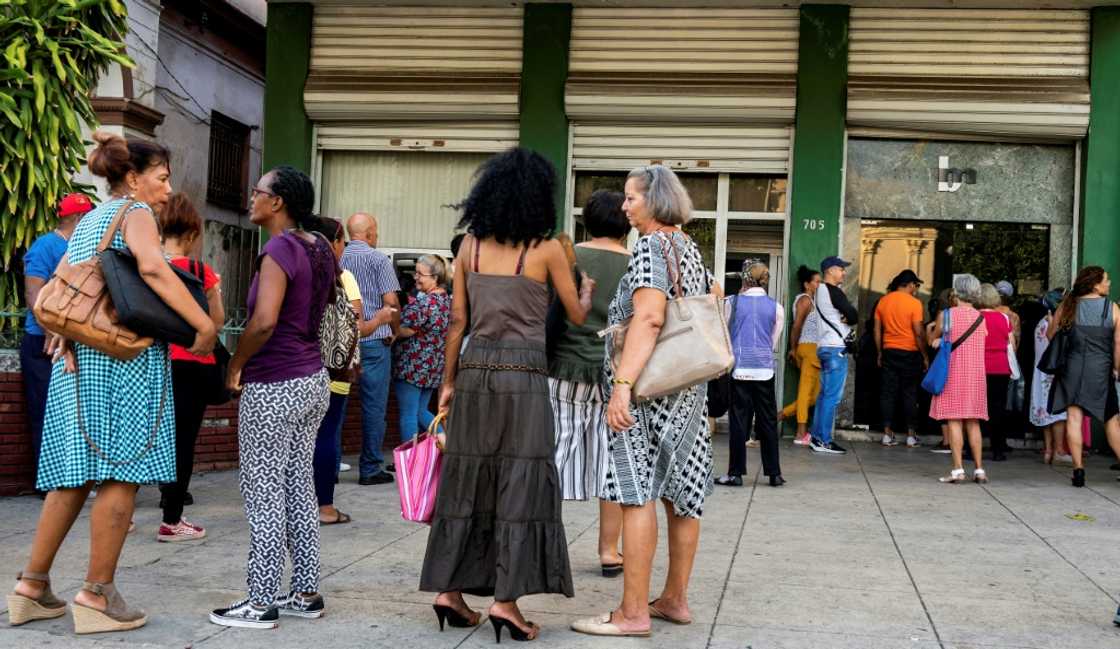 Long wary of the country's poorly functioning banks, Cubans have in recent months embraced cash even more, to avoid long lines and withdrawal limits at ATMs