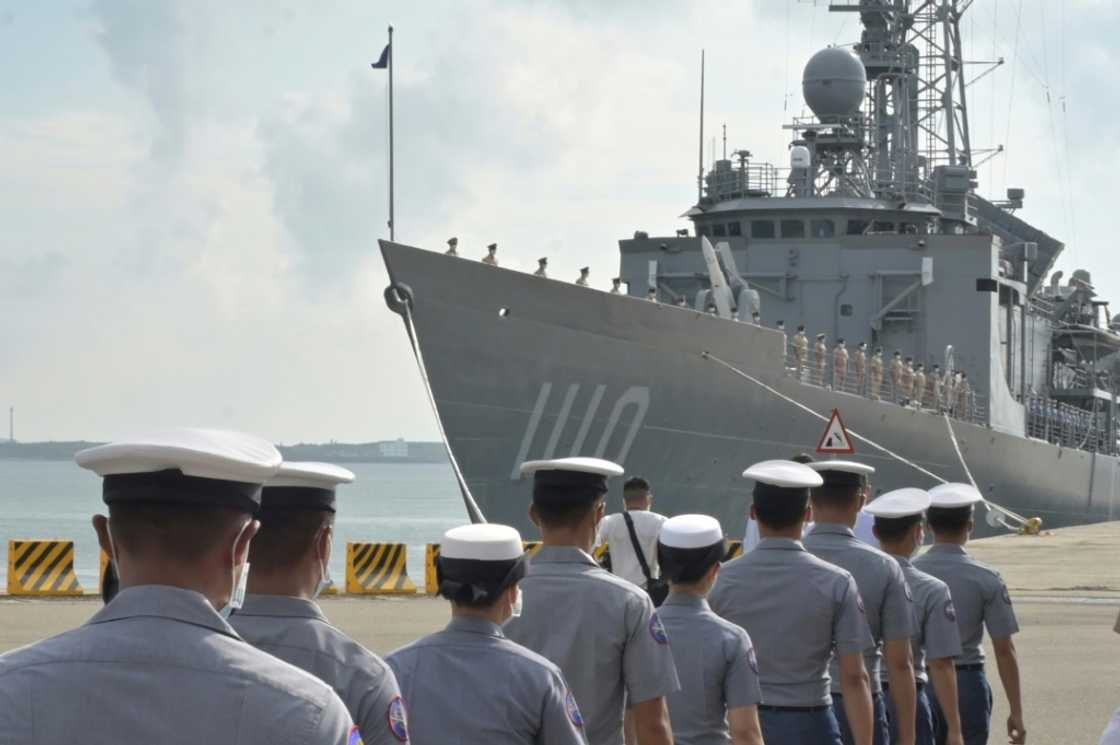 Taiwanese sailors walk in front of a frigate as President Tsai Ing-wen inspects troops on the Penghu islands amid high tensions with Beijing Taiwanese sailors walk in front of a frigate as President Tsai Ing-wen inspects troops on the Penghu islands amid high tensions with Beijing