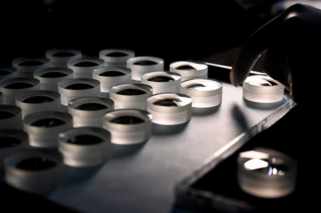 An employee prepares a lens at the Leica factory in Wetzlar, western Germany An employee prepares a lens at the Leica factory in Wetzlar, western Germany