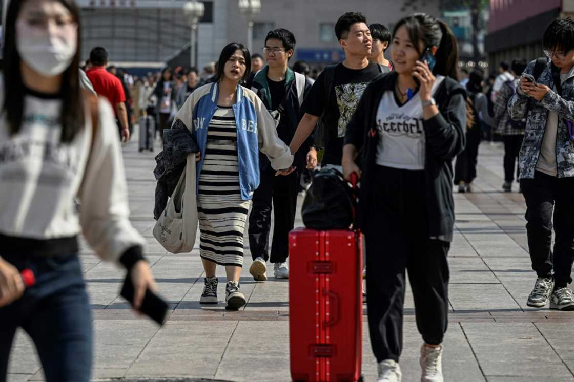 China's state media reported a significant boost in the number of travellers compared with the same period last year China's state media reported a significant boost in the number of travellers compared with the same period last year