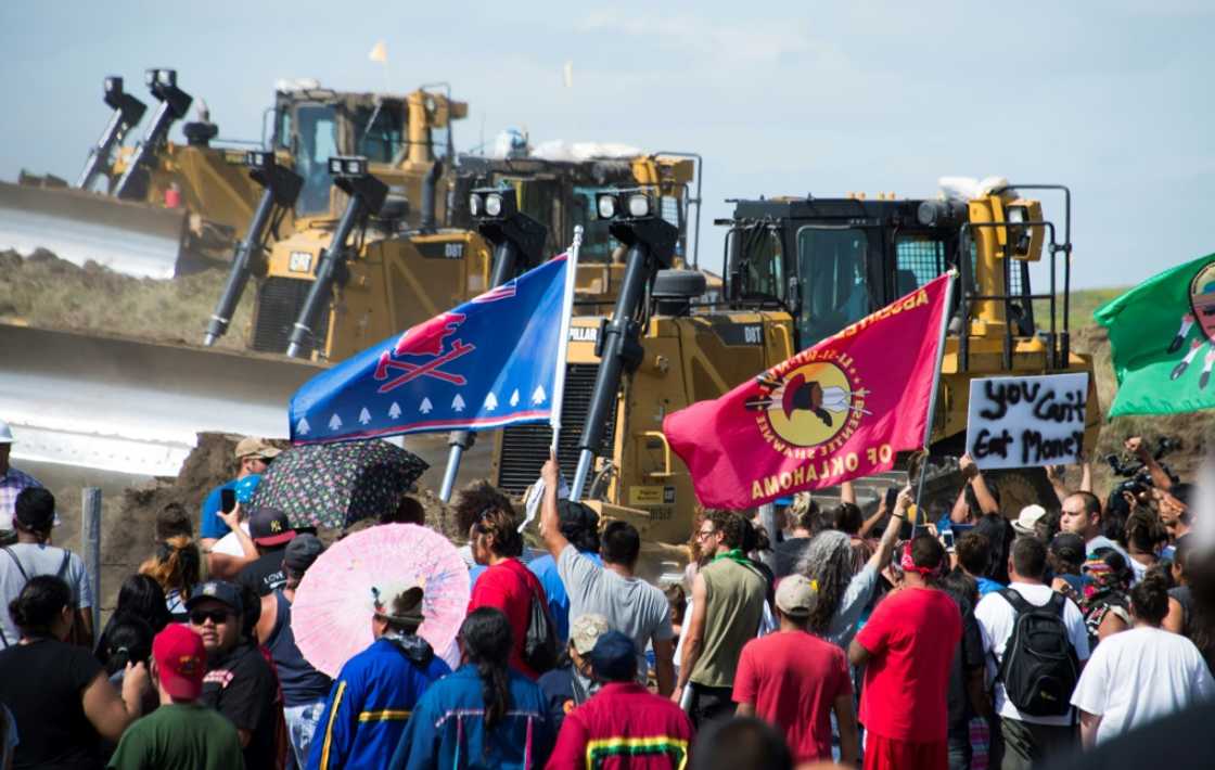 Members of the Standing Rock Sioux Tribe and their supporters opposed to the Dakota Access Pipeline (DAPL) confront bulldozers working on the new oil pipeline in an effort to make them stop on September 3, 2016, near Cannon Ball, North Dakota Members of the Standing Rock Sioux Tribe and their supporters opposed to the Dakota Access Pipeline (DAPL) confront bulldozers working on the new oil pipeline in an effort to make them stop on September 3, 2016, near Cannon Ball, North Dakota