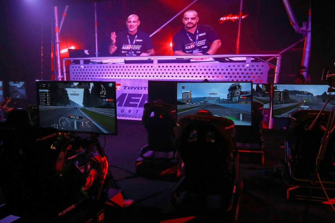 The races were projected on a big screen, accompanied by live commentary and shouts of support from the crowd The races were projected on a big screen, accompanied by live commentary and shouts of support from the crowd