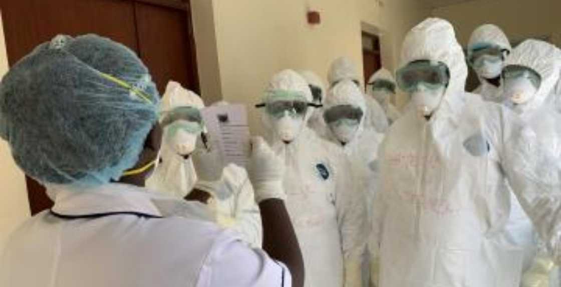 Health workers in protective clothing