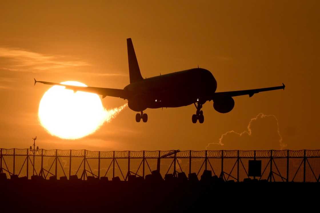 A commercial plane prepares to land at Ngurah Rai international airport in Denpasar, on Indonesia's Bali island