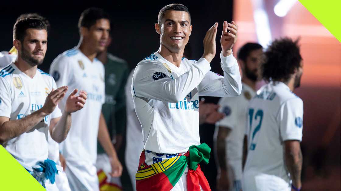 Cristiano Ronaldo celebrates with his teammates after helping Real Madrid three-peat the UEFA Champions League.