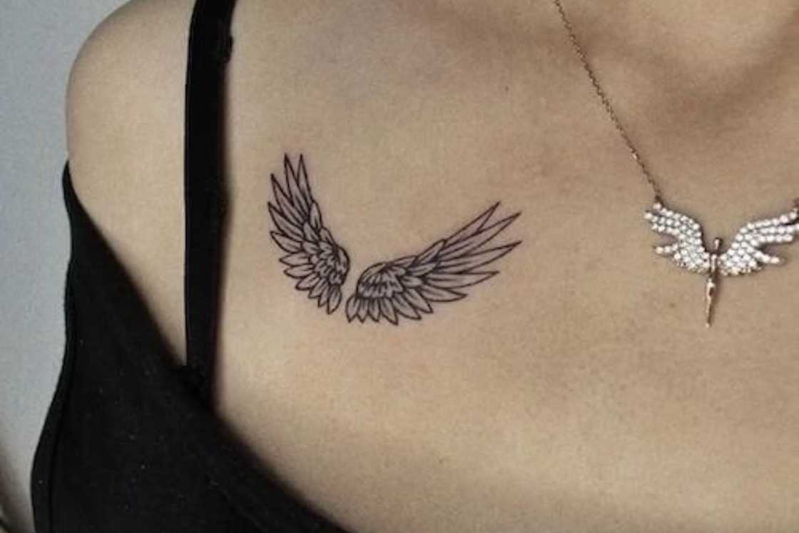 A tiny pair of angel wing shoulder tattoo A tiny pair of angel wing shoulder tattoo