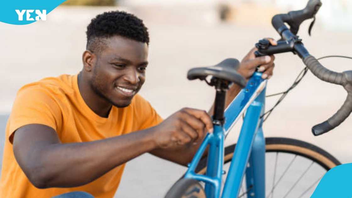 Kumasi-based boy, bicycle, motorbike, converts, young Ghanaian Kumasi-based boy, bicycle, motorbike, converts, young Ghanaian