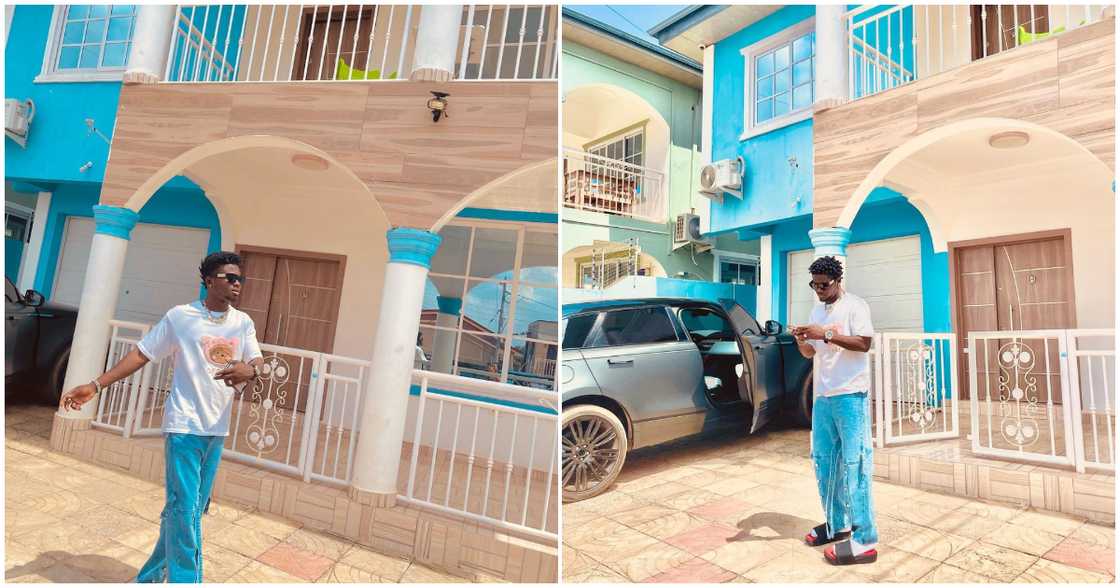 Kuami Eugene poses infront of his beautiful house