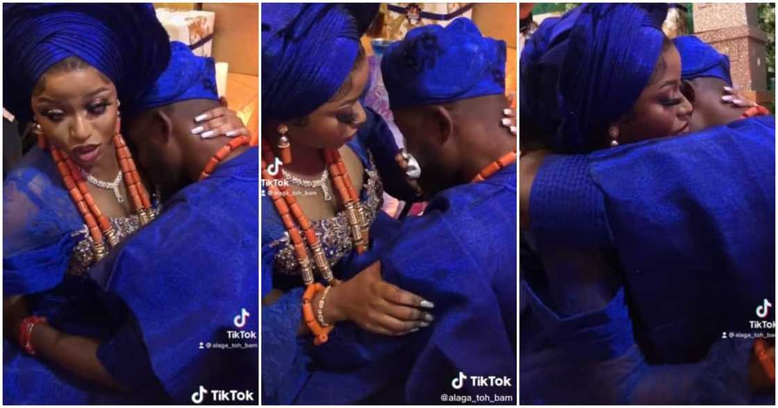 Nigerian groom cries at wedding, groom weeps at wedding, kneeling groom cries, bride comforts groom, traditional wedding