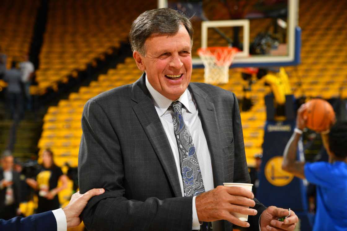 Kevin McHale is laughing holding a cup