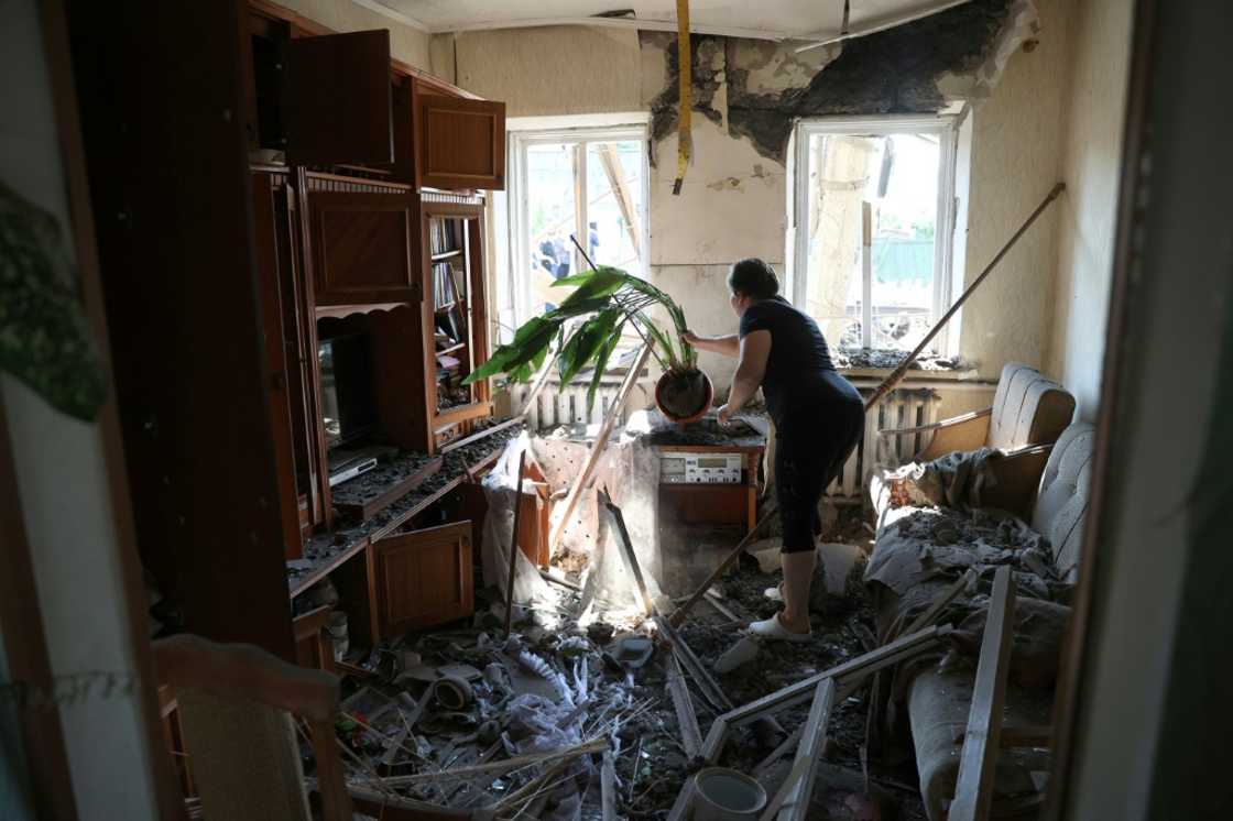 A woman cleans debris in her house after a Russian missile strike on the Donetsk region town of Konstantinovka A woman cleans debris in her house after a Russian missile strike on the Donetsk region town of Konstantinovka