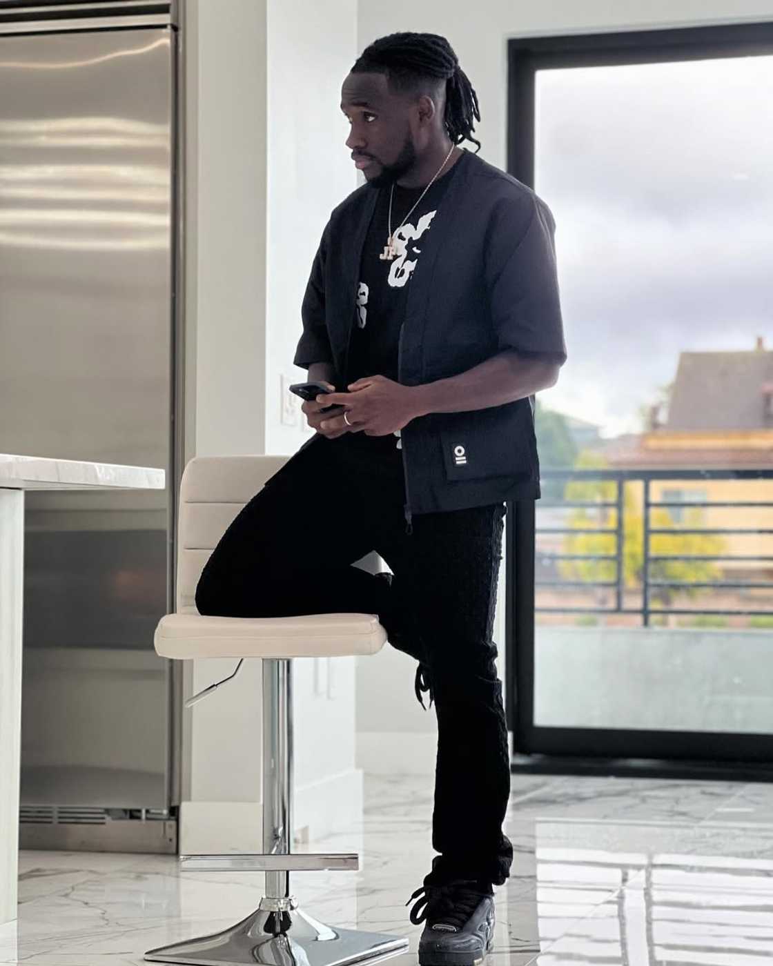 Joseph Paintsil poses for a picture in his lavish residence in Los Angeles Joseph Paintsil poses for a picture in his lavish residence in Los Angeles