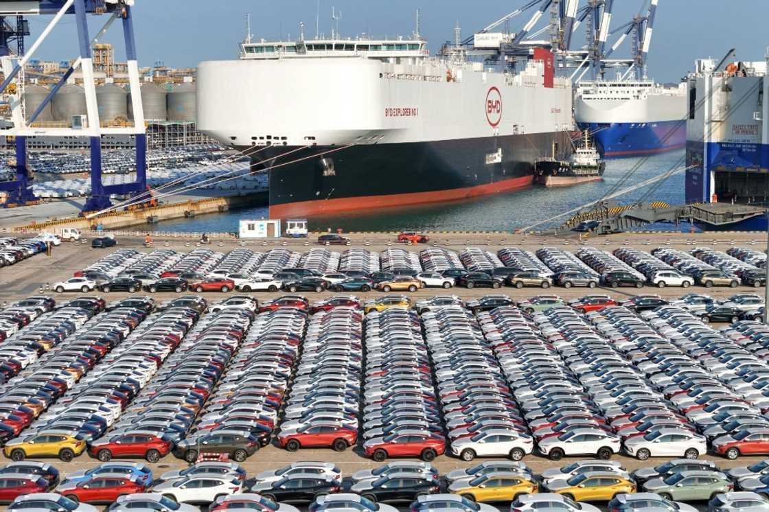 Electric cars waiting to be loaded onto a vessel in China to be transported Electric cars waiting to be loaded onto a vessel in China to be transported
