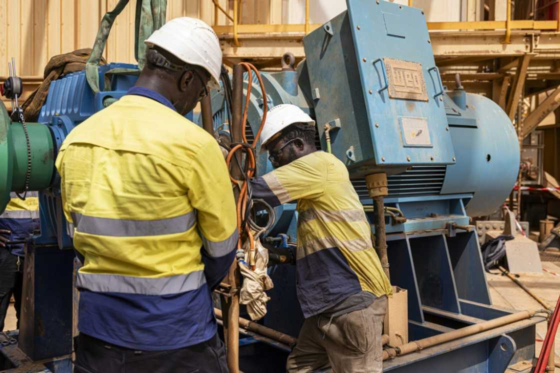 EGC workers in Senegal on the huge floating factory attached to the dredging rig EGC workers in Senegal on the huge floating factory attached to the dredging rig