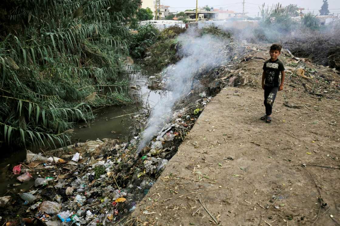 A child stands next to a polluted water source at a make-shift camp for Syrian refugees in Talhayat, near Bebnine, north Lebanon A child stands next to a polluted water source at a make-shift camp for Syrian refugees in Talhayat, near Bebnine, north Lebanon